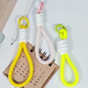 Colorful woven phone lanyard wrist strap keychain with metal clip and stylish design.