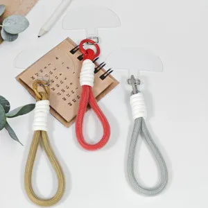 Woven phone lanyard wrist strap with transparent tether tab for keys and small items detail view