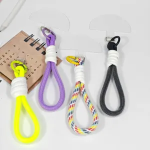 Detailed view of colorful woven phone lanyards wrist straps with clear tether tabs set.
