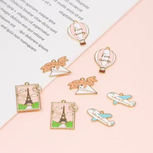 DIY alloy charms set featuring airplane, hot air balloon, and Eiffel tower for jewelry making.