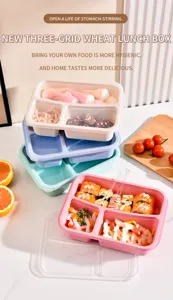 Boîte à bento en paille de blé à trois compartiments avec fourchette pour repas sain.