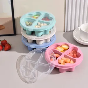 Scatola porta snack di frutta in paglia di grano a forma di cuore con coperchio trasparente.