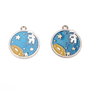 Detailed close-up of blue and yellow space astronaut round alloy charms pendants DIY jewelry.