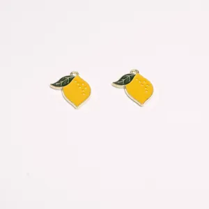 Detailed shot of yellow lemon enamel alloy charms, perfect for DIY jewelry and necklaces.