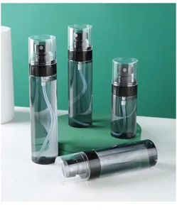 Detail view of portable clear plastic spray bottles for travel toner and cosmetic liquid.