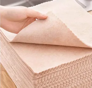 Close-up detail of soft absorbent kitchen dishcloth fabric, showing textured cleaning rag layer.