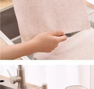 Detailed view of thick microfiber cleaning cloth showing absorbent texture and wavy edge near sink.