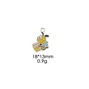 Enamel alloy bee pendant holding book DIY keychain bag decoration charm accessory 18x13mm