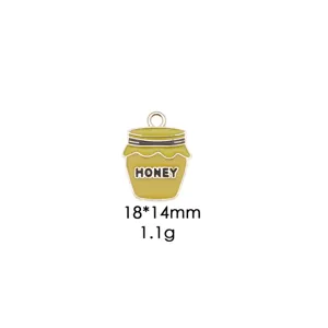Close-up detail of enamel honey pot pendant, alloy metal craft, 18x14mm DIY accessory.