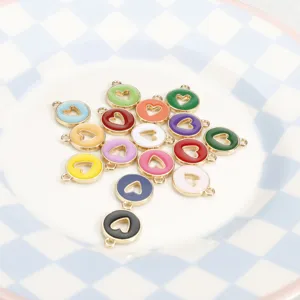 Detailed view of colorful enamel heart charms, metal alloy DIY pendant connectors for bracelets.