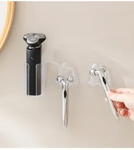 Punch-free wall mounted razor holder clear plastic bathroom organizer for electric shavers.