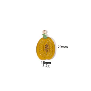 Close-up detail shot of the Thanksgiving pumpkin alloy pendant, showing fine enamel texture.