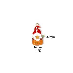 Thanksgiving pumpkin gnome enamel charm pendant detail view, zinc alloy DIY jewelry accessory.