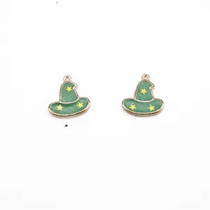 Close-up detail of green wizard hat alloy charms with gold stars for DIY handmade jewelry crafting.