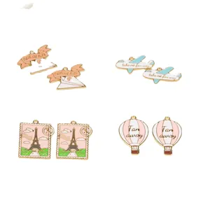 DIY enamel alloy charms set featuring airplane, hot air balloon and Eiffel tower pendants.