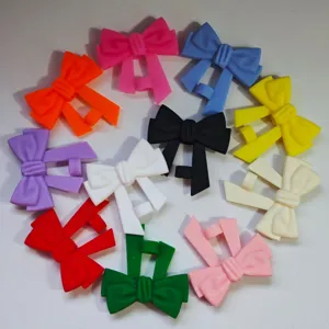 Close-up details of colorful silicone bow straw covers displayed in vibrant multi-color design.
