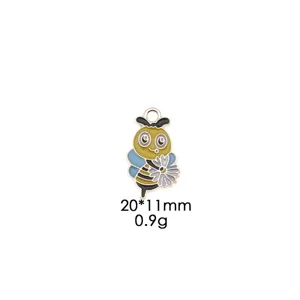 Close-up detail of cute enamel bee daisy alloy pendant, smooth drip oil craft, DIY charm.