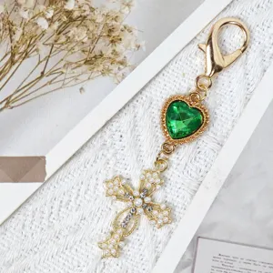 Gold alloy cross keychain with green heart gem, pearls and rhinestones, vintage bag charm.