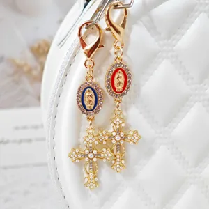 Exquisite alloy rhinestone cross and Virgin Mary medallion keychain bag pendant detail.