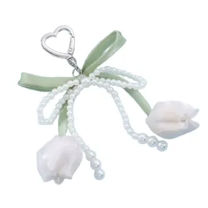 Sweet pearl ribbon tulip keychain and bag charm with metal heart clasp, cute aesthetic accessory.