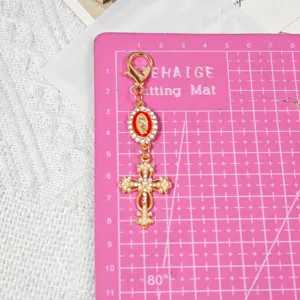 Gold alloy rhinestone cross keychain pendant with Madonna charm and lobster clasp for DIY crafts.