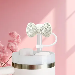 Rhinestone bow straw topper detail shot, sparkling dust cover for daily cups and tumblers.