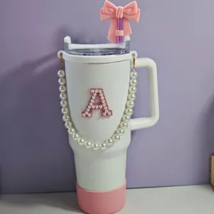 White tumbler with pink bow straw cover pearl strap and letter A patch cute design cup