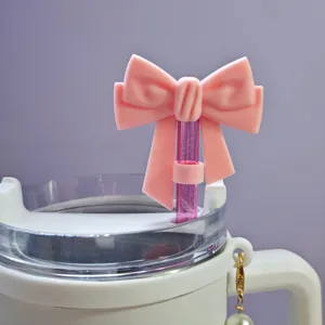 Silicone pink bow straw cover detail shot, cute dust plug for 10mm drinking cups.