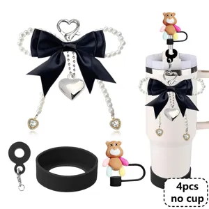 Tumbler accessories set including black bow pearl charm, silicone boot, and bear straw cover.