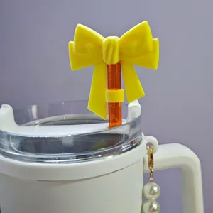 Silicone straw topper detail, bright yellow bow design for 10mm cups, cute dust plug.