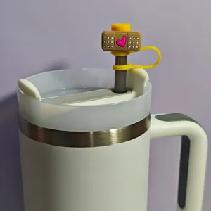 Detailed shot of cute medical cartoon hammer straw cover accessory for Stanley tumbler cup.