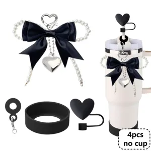 Tumbler accessories set featuring a pearl bow charm, silicone boot, and heart straw cover.