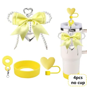 Yellow tumbler accessory set including cute bow pearl charm, heart straw cover and silicone boot.