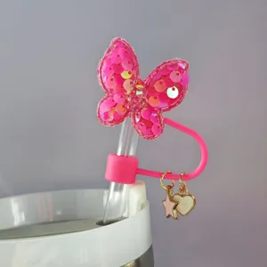 Copertura per cannnuccia a farfalla con paillettes rosa e ciondoli a stella da 10mm.