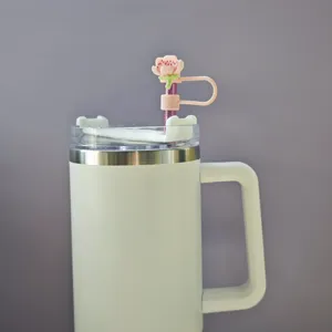 Stainless steel insulated tumbler with cute cherry blossom straw topper and handle for daily use.