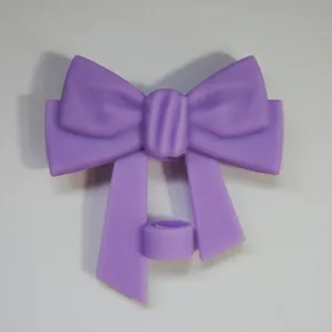 Close up of cute purple silicone bow straw cap, perfect dust-proof cover for 10mm tumblers.