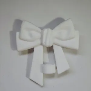 White silicone bow straw cover detail, showcasing the fine texture and stable base structure.