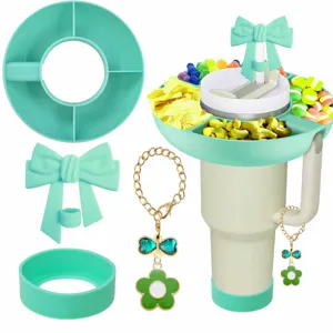 Silicone snack tray for 40oz tumbler with bow straw topper, cup boot and cute flower chain.