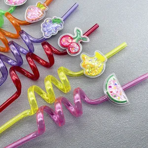 Close-up detail of colorful curly plastic drinking straws with glitter fruit charms for kids party.