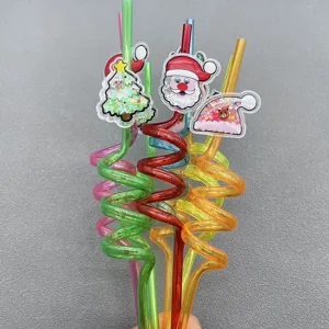 Detailed view of colorful Christmas curly plastic drinking straws featuring festive glitter Santa and tree charms.