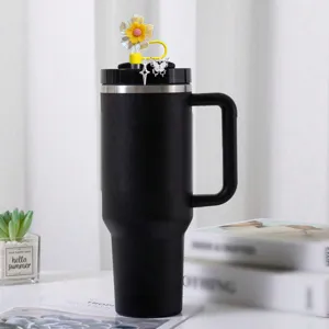 Black tumbler with creative colorful flower straw cap and cute butterfly star charm accessories.