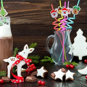 Christmas spiral drinking straws with cute Santa and reindeer decorations for holiday party.