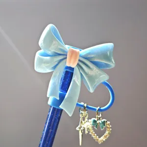 Cute blue bow straw cap with glitter straw and heart star pendants for daily drink use.