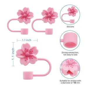 Detail view of pink silicone flower straw cover showing size and material specifications.