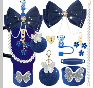 Stanley tumbler accessory set featuring blue bows, pearl chains, cute charms, and silicone cup sleeves.