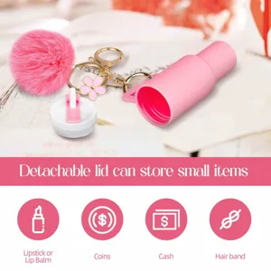 Mini tumbler keychain detail showing detachable storage lid, fluffy pompom and floral charm.