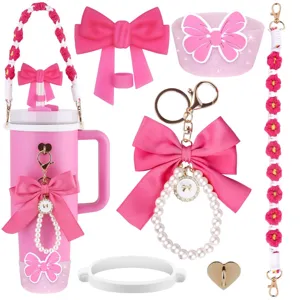 Pink cute tumbler accessories set featuring bow straw topper, pearl keychain, and floral strap.