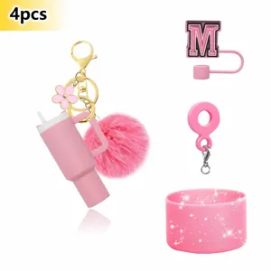 Pink mini tumbler keychain set with pom pom letter straw cover and glitter silicone boot