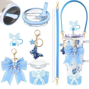 Blue tumbler accessory details featuring cute bowknot, butterfly keychain and cup sleeve parts.
