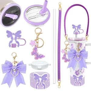 Purple insulated tumbler cup set with cute bow charms, butterfly keychain, and straw lid.